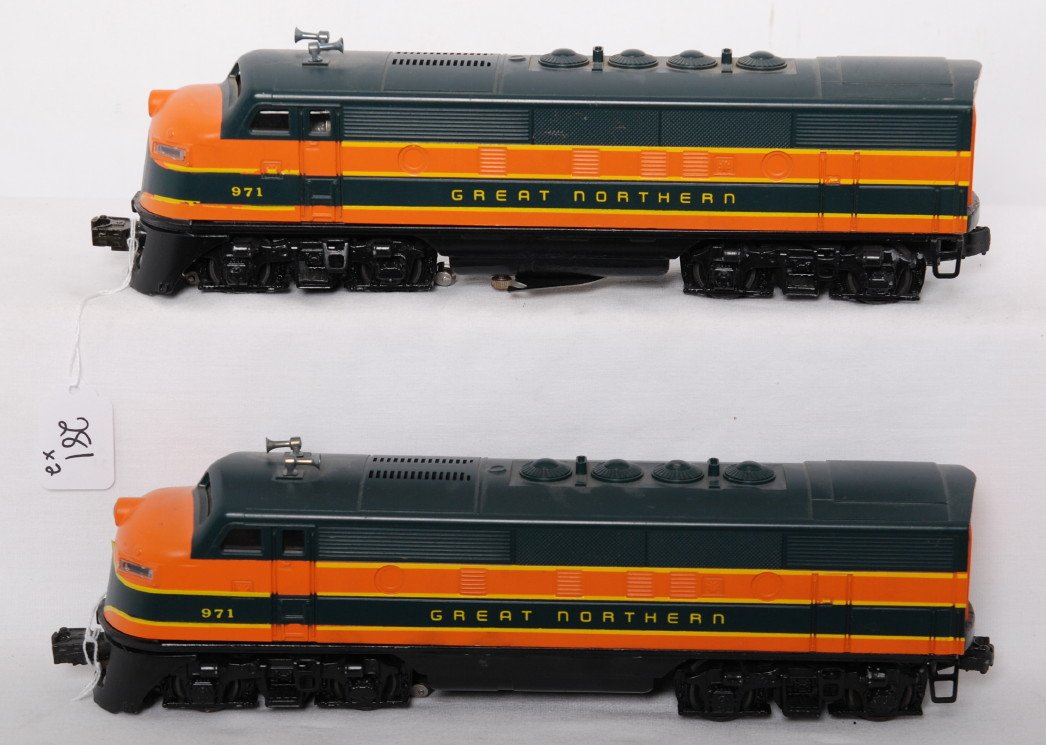 Lionel Great Northern F3a diesels on PW chassis: Postwar Lionel O gauge powered and dummy F3a diesel locomotive chassis with repainting and cleaning to powered unit due to battery damage. Modern era reproduction Great Northern 971 F3a diesel locomot