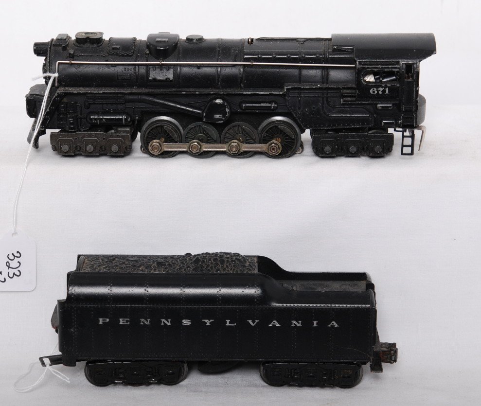 Lionel 671 steam turbine loco with 2671W PRR: Postwar Lionel O gauge 671 Turbine steam locomotive with 2671W Pennsylvania whistle tender, with hairline at rear screw and heavy scratch. Trains otherwise look C6.