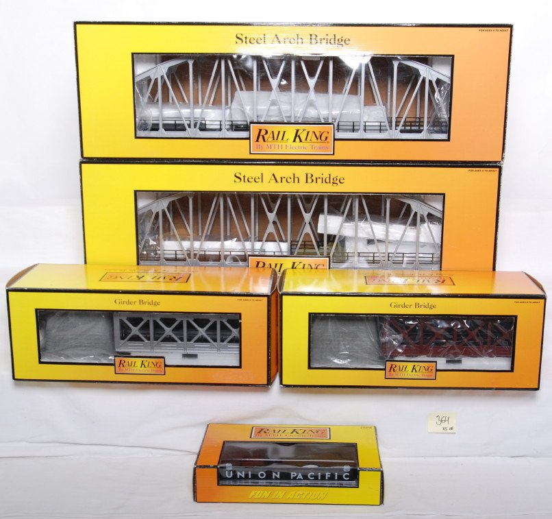 5 Railking bridges 1013, 1032, 12002: MTH Railking modern O gauge bridges in OBs. Includes two 40-1013 arch bridges, two 40-1032 girder bridges, and 30-12002 die cast Union Pacific girder bridge. Items are C9-10