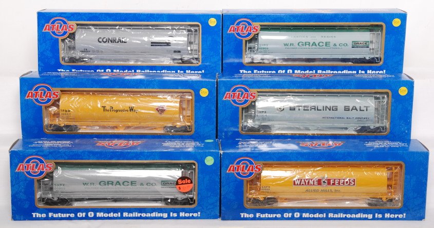 6 Atlas O cylindrical grain hoppers: Atlas modern O gauge cylindrical grain hoppers in OBs. Six cars include 6306-4 WR Grace and Co., 6309-2 Sterling Salt, 6306-2 WR Grace and Co., 6302-1 Conrail, 6310-2 TP&W, 6305-4 Wayne Feeds. Cars ar