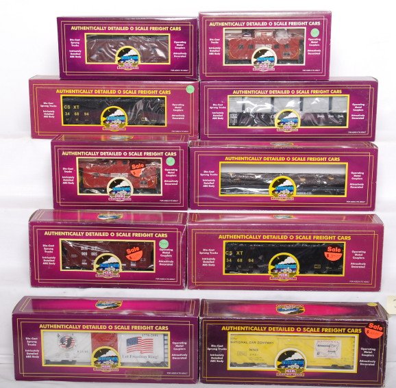 10 MTH freight cars 91033, 91162, 93092, etc.: MTH modern O gauge freight cars in OBs. Ten cars include two 91033 Norfolk Southern cabooses, 98034 Nickel Plate gondola, two 97407 CSX hoppers, 98373 Elk River flat with logs, 91162 New Haven caboose