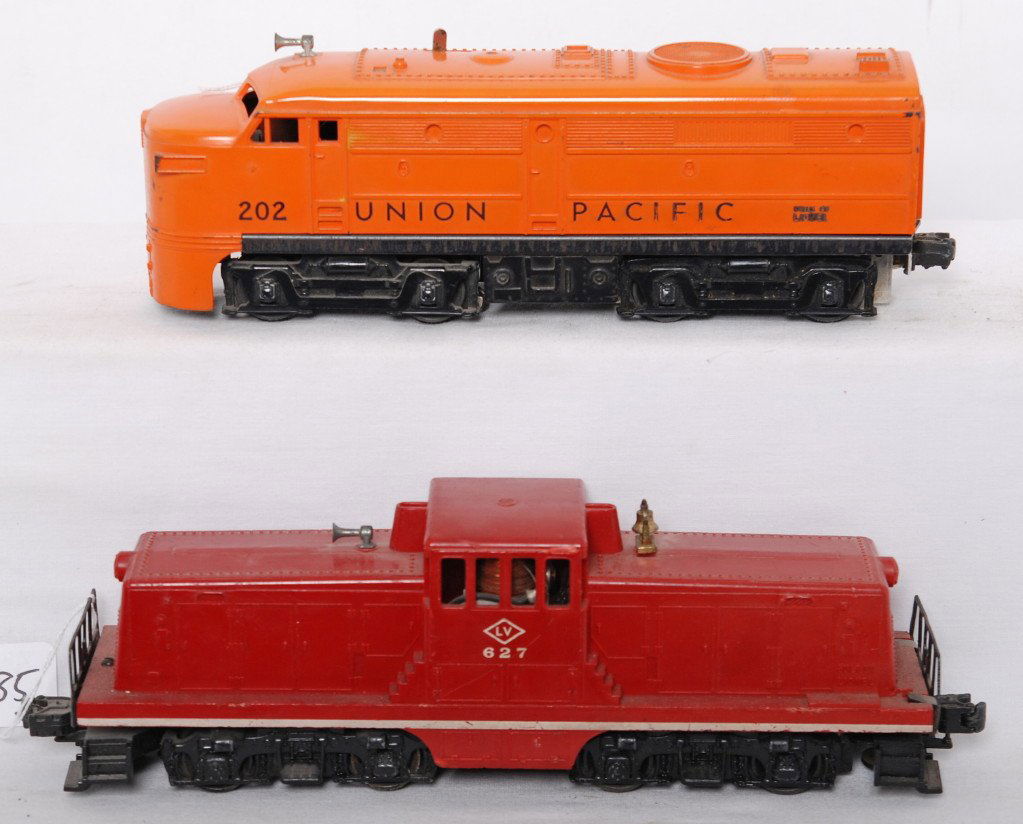 Lionel 202 UP diesel and 627 LV GE 44 ton: Postwar Lionel O gauge locomotives, 627 Lehigh Valley GE 44 ton diesel electric, hairline at screw and chips to cab overhang, C5-6. 202 Union Pacific diesel Alco A unit, C6.