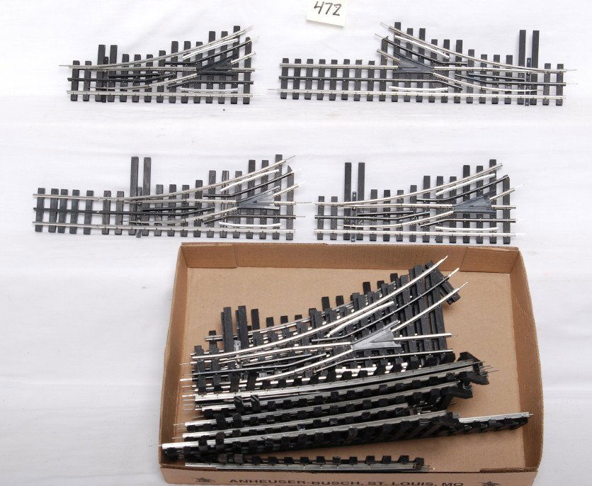 14 Ross Custom 0-42 switches: Ross Custom modern O gauge 0-42 switches. Fourteen switches total, five right hand and nine left hand. Switches are C8 with layout use. No switch machines.