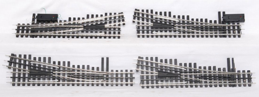 4 Ross Custom 11 degree switches: Ross Custom modern O gauge eleven degree switches. Four switches total, three right hand and one left hand. Switches are C8 with layout use. Two DZ-1000 machines installed.