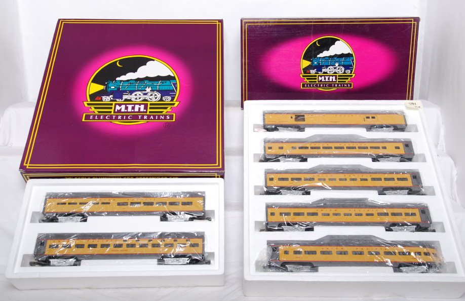 MTH 6506 6510 Union Pacific Pass Cars: MTH modern O gauge Union Pacific 70-foot scale painted aluminum passenger cars including; MT-6506 five-car set and MT-6510 sleeper/diner two-car set. Both sets are C8 condition with run time. OBs have