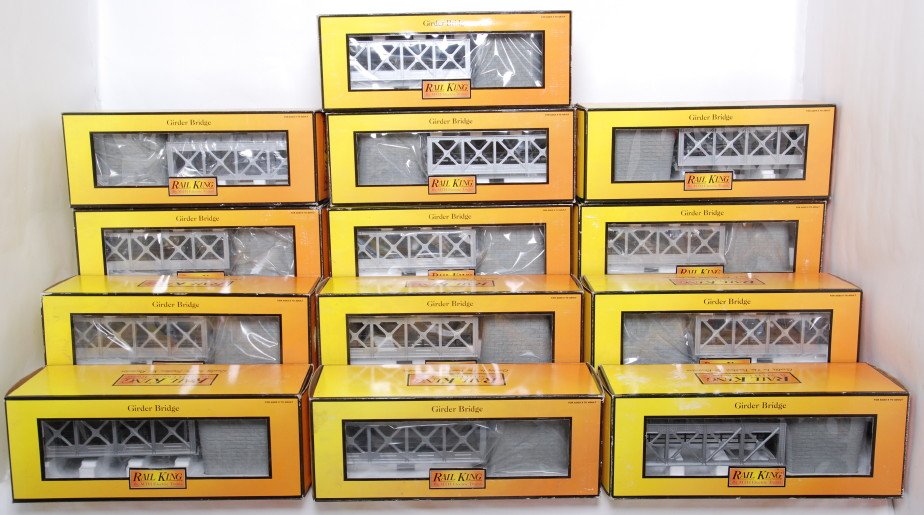 13 Railking silver girder bridges: MTH Railking modern O gauge 40-1014 silver girder bridges in OBs. Thirteen bridges total. C8 to C10. OBs have some wear.