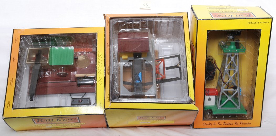 3 MTH American Flyer accessories Gabe, 787, 23796: MTH modern O gauge accessories. Three American Flyer reissues. Includes 9126 Gabe the Lamplighter, 9119 787 log loader missing controller, and 9122 23796 saw mill. Items are layout used C8. OBs have s