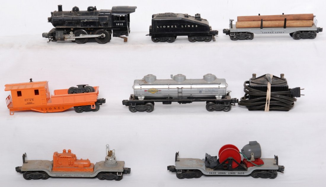Lionel 1615, tender, 6411, tank, 3650, 3620, 6119-: Postwar Lionel O gauge 1615 steam switcher, unnumbered slopeback tender, 6411 log car, unnumbered Sunoco tank, 3650 extension searchlight car, 3620 searchlight car, 6119-25 DLW work caboose, and type 