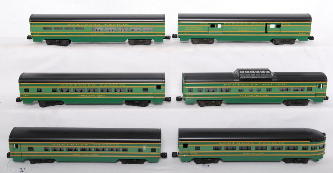 Custom Lionel Northern Pacific six car passenger : Lionel modern O gauge custom Northern Pacific aluminum passenger car set. Six cars include observation, two coaches, diner, baggage, and vista dome. Cars are generally C8, however some small areas of 