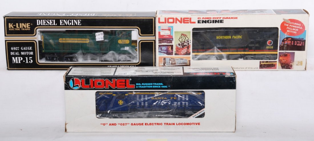 3 Lionel and K line locos 8857, 18803, 2252IC: Lionel and K Line modern O gauge diesel locomotives in OBs. Includes 8857 Northern Pacific U36B, 18803 Santa Fe RS-3, and K-2252IC Kennecott MP-15. Locos are C7-8. Some light spots of frame rust on th