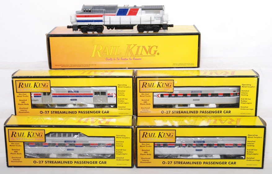 Railking Amtrak Dash 8 and four passenger cars: MTH Railking modern O gauge 30-2164-1a Amtrak Dash 8 diesel locomotive with Protosound, Protocouplers, and more. Four passenger cars include 6000 through 6003. Includes coach, baggage, vista dome and 