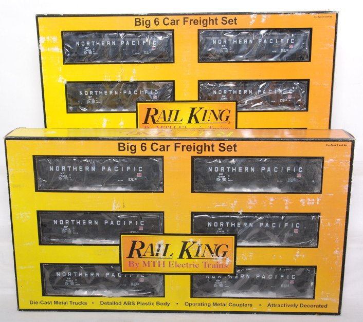 2 Railking hopper six car hopper sets: MTH Railking modern O gauge Northern Pacific four bay coal hoppers in OBs. Two 30-7531 six packs are C8 condition. OBs have light wear.