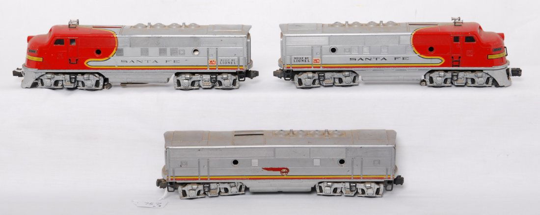 Lionel 2343P, 2343C, and 2343T Santa Fe F3 diesels: Postwar Lionel O gauge 2343P, 2343C, and 2343T Santa Fe EMD F3 diesel A-B-A units with some original port hole lens, missing one front hand grab, hairline in cab roof of powered unit, large GM decals,