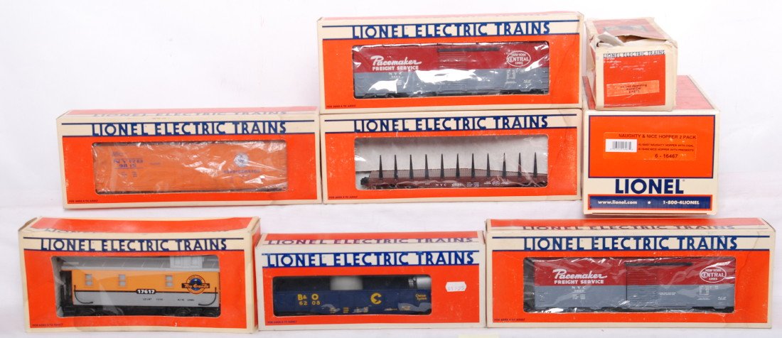 9 Lionel freight cars 16467, 9815, 9235, etc: Lionel modern O gauge freight cars in OB. Nine freight cars include 17617 Rio Grande caboose box has water damage, 6521 New York Central flat, 9815 New York Central reefer box has water damage, 16467 