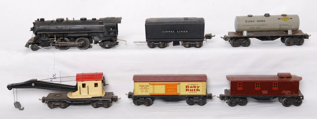 Lionel 229, O2689W, 2679, 2680, crane, 2682: Prewar Lionel O gauge steam freight set, C5-6. 229 steam locomotive, O2689W whistle tender, 2679 Baby Ruth boxcar, 2680 Sunoco tank, unnumbered operating crane, and 2682 New York Central caboose (dent