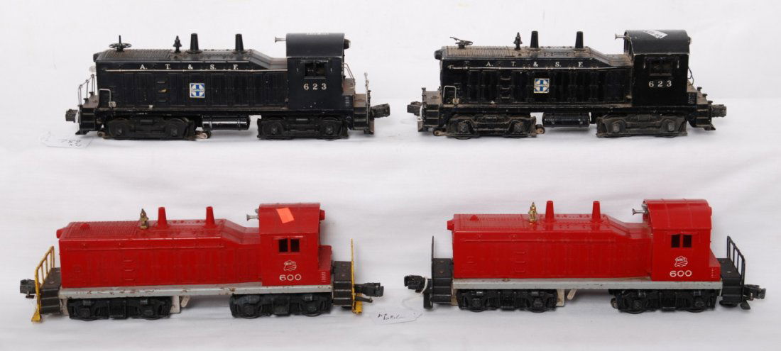 Lionel NW2 diesel switchers, 600 x2 and 623 x2: Postwar Lionel O gauge NW2 diesel switcher locomotives, C5-6. Two 600 MKT (both have a hairline at screw) and two 623 ATSF (one is repainted).