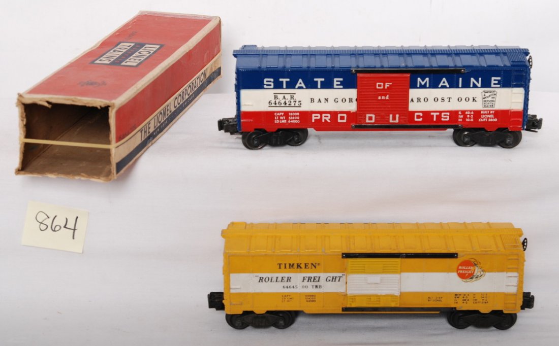 Lionel 6464-275 in OB and 6464-500: Postwar Lionel O gauge 6464-275 State of Maine boxcar white mold solid red door, C6 in OB. 6464-500 Timken boxcar unusual gray mold body, C6.