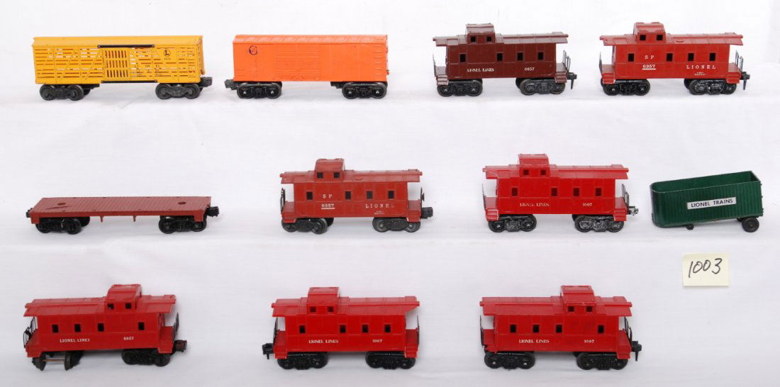 Lionel 6656, 6004, 1007 x3, 6037, 6057, 6357 x2..: Postwar Lionel O gauge freight cars with chipped, cracked, and repaired shells, etc. 656, 6004, 1007 x3, 6037, 6057, 6357 x2, and unnumbered flatcar with Lionel Trains trailer van. Please view the pho