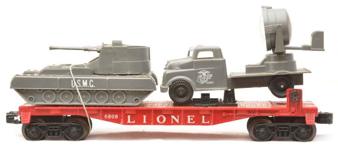 Lionel 6808 Flatcar w/2 Tank and Searchlight Truck: Lionel postwar 6808 flatcar with Marine Corps two gun tank and searchlight truck car that are original loads. The car is C8.