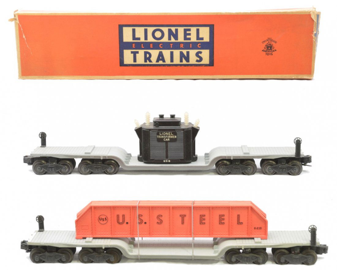 Lionel 6518 Transformer ON 6418 Machinery Cars: Lionel postwar 6518 transformer car in a worn OB and a 6418 machinery car that has two pinkish orange U.S. Steel girders. All of the insulators are intact on the transformer car. The cars are C7-8.