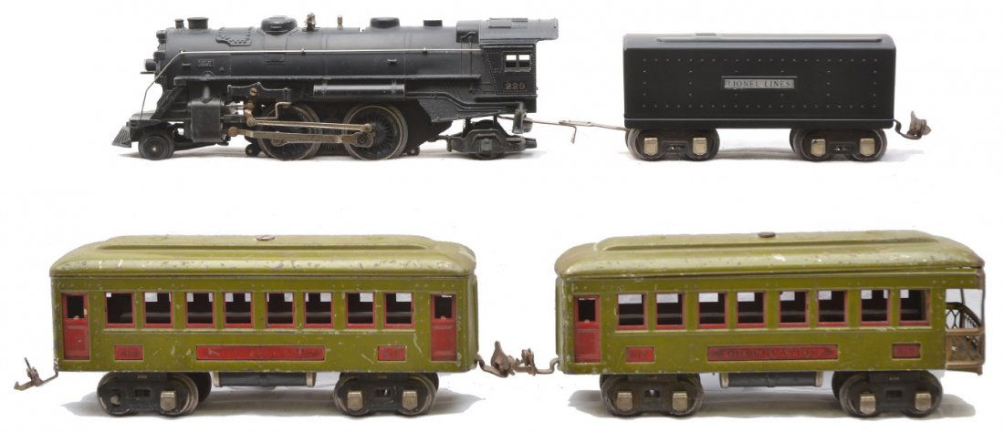Lionel 229 Loco 1689T Tender 610 612 Pass Cars: Lionel prewar O gauge 229 black 2-4-2 steam loco and a 1689T tender that has nickel journals. The loco is C6. The tender has a gunmetal frame and a black restored top. Also included are two olive pass