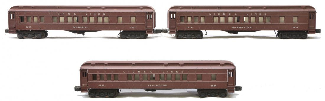 Lionel Passenger Cars 2625 2627 2628: Lionel postwar passenger cars without silhouettes including; 2625 Irvington Pullman, 2627 Madison Pullman and a 2628 Manhattan Pullman. The 2628 car has a yellow spot on the roof, otherwise cars are C