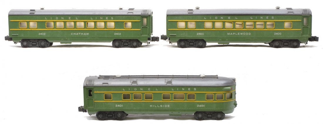 Lionel Green Passenger Cars 2400 2402 2401: Lionel postwar green passenger cars with gray roofs and yellow stripes; 2400 Maplewood Pullman, 2402 Chatham Pullman and a 2401 Hillside observation. Roofs have mold marks, otherwise cars are C7.