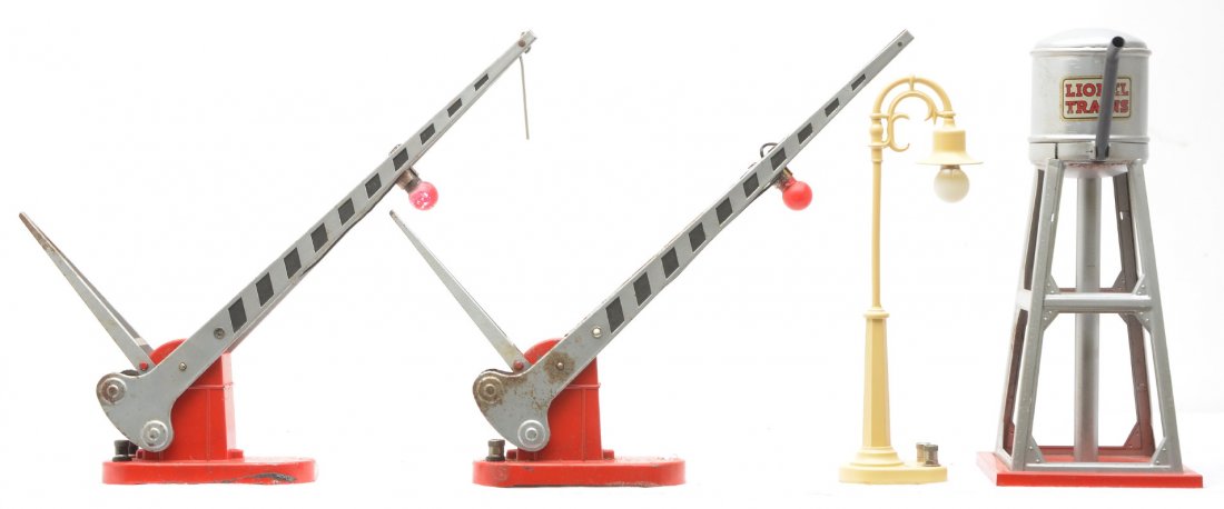 Lionel Postwar Accessories 58 93 152 152: Lionel postwar accessories; 58 cream lamp post that has been restored, 93 water tower and two 152 automatic crossing gates. The 152 gates are C5-6 and the water tower is C6-7.