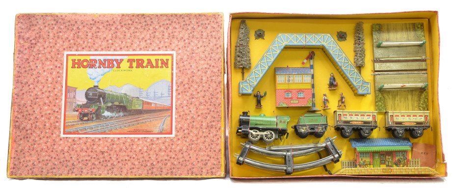 Hornby M-9 Complete Litho Model RW Set: Hornby gauge O manufactured by Meccano Limited, Liverpool, England M-9 complete lithographed model railway set, circa 1934 in OB with original cardboard insert containing; clockwork loco, tender two p