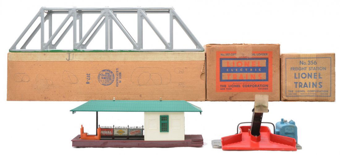 Lionel Accessories 317 356 397 Boxed: Lionel postwar accessories including; 317 trestle bridge that has green paint along the bottom edge from a layout, 356 freight station with one cart and a 397 operating coal loader all in OBs. The acc