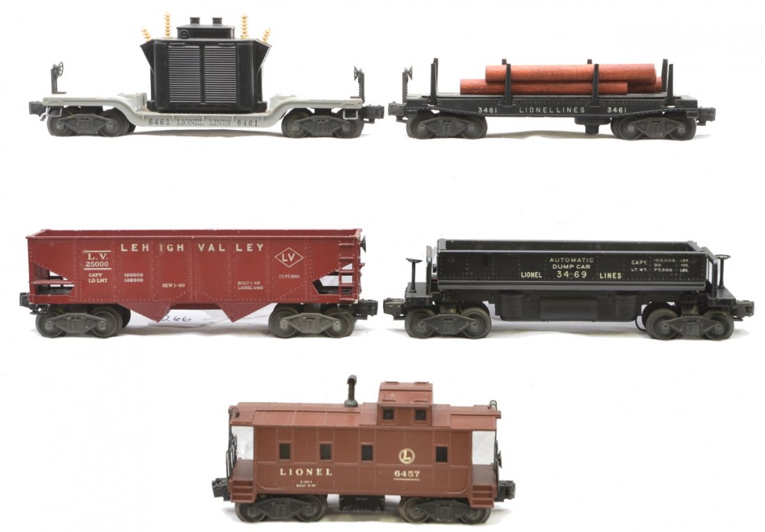 Lionel Freights 3461 6461 3469 6456 6457: Lionel postwar freight cars including; 3461 log car with instruction sheet, 6461 generator car, 3469 automatic dump car, 6456 maroon Lehigh Valley hopper and a 6457 caboose. The cars are C6-7.