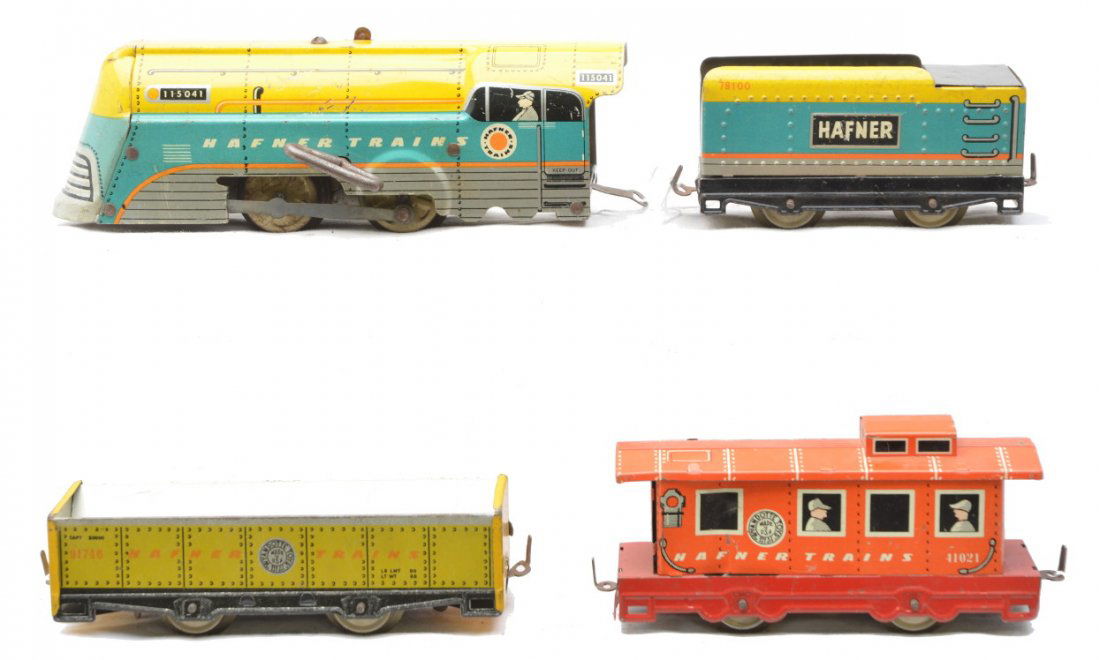 Hafner Wyandotte Litho Clockwork Freight Set: Hafner Wyandotte Toys lithographed freight set consisting of a 115041 0-4-0 clockwork steam loco, 78100 tender, 91746 yellow sand car and a 41021 red caboose. The set is C6.
