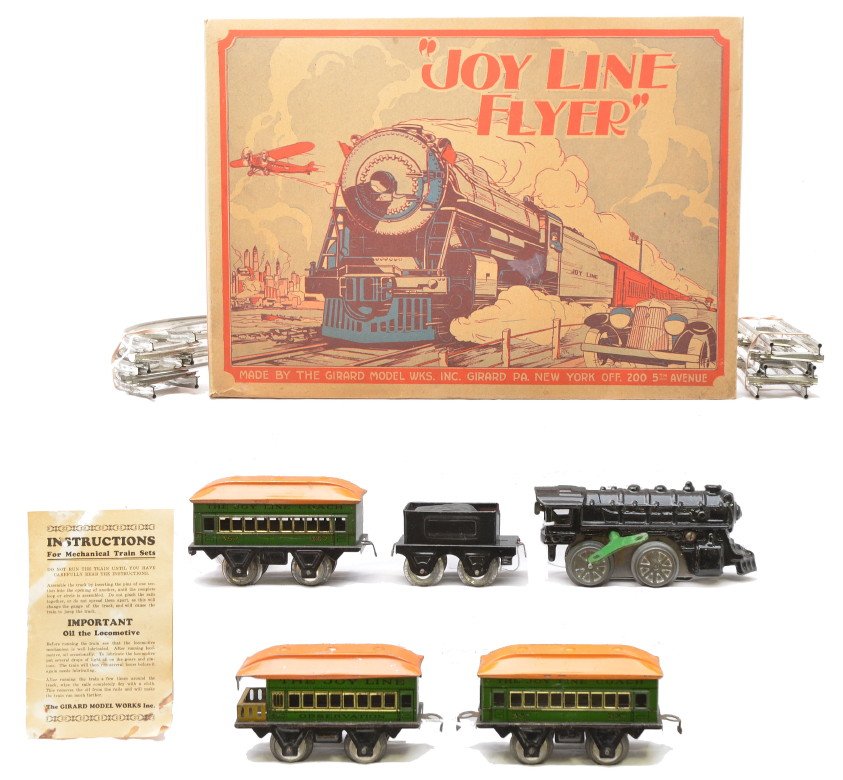 Joy Line Girard Model Works Litho Pass Set 48117: Joy Line by Girard Model Works lithographed passenger set no. 48117 in OB with original cardboard inserts containing; black cast iron 0-4-0 clockwork steam loco, black four wheel tender, three green f