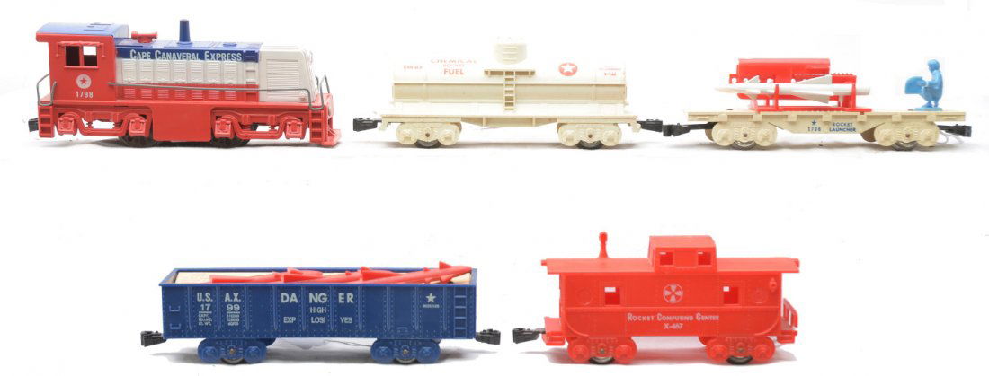 Marx Cape Canaveral Freight Train Set: Marx Cape Canaveral freight set consisting of a 1798 diesel, 1799 gondola with three red missiles and original cardboard insert, X246 chemical Rocket Fuel tank car with a crack in one end that has bee