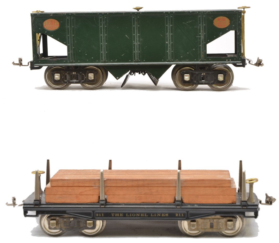 Lionel 211 Black Flatcar 216 Dark Green Hopper: Lionel prewar standard gauge freight cars including; 211 black flatcar with wood load, nickel trim and journals and a 216 dark green hopper with brass trim and nickel journals. The cars are C6.