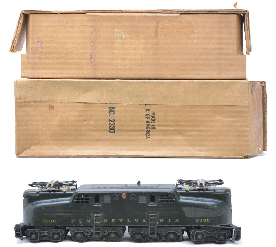 Lionel 2330 Green PRR GG1 Electric Diesel: Lionel postwar 2330 green Pennsylvania GG1 electric diesel in OB with original cardboard insert. The striping is faded on the loco. Loco is C6. The OB has all flaps but is worn.
