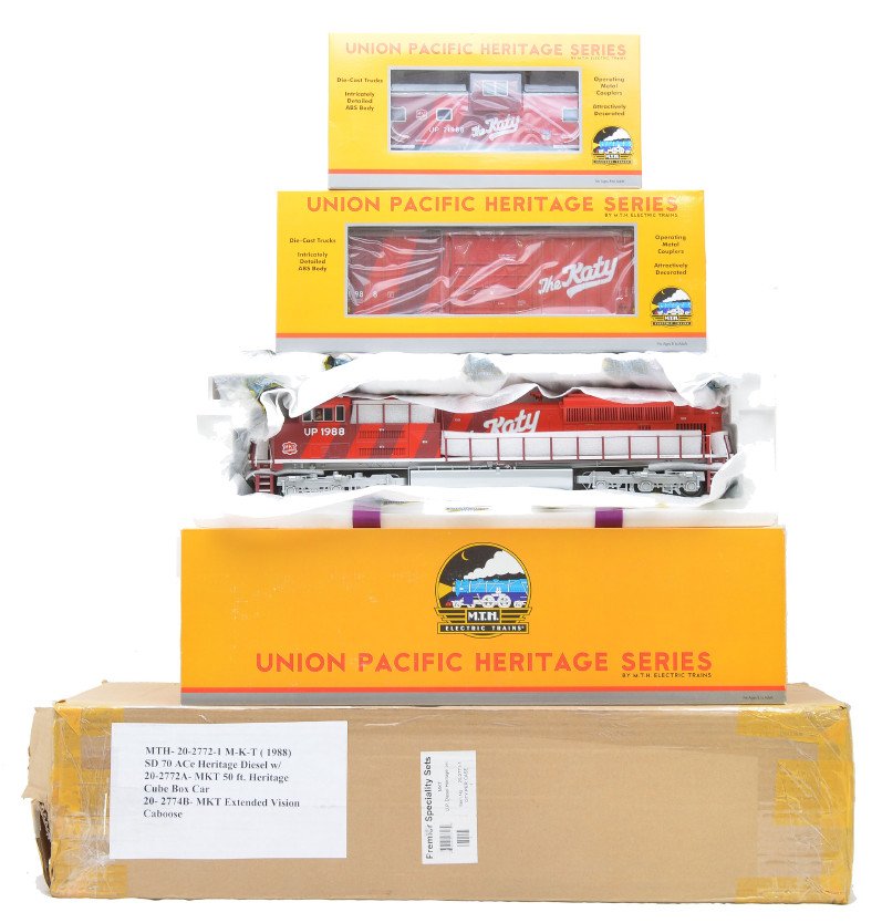 MTH Premier Specialty MKT UP Heritage Set: MTH Premier Specialty MKT Union Pacific Heritage set including; 20-2772-1 SD70ACe diesel engine with Proto-Sound 2.0, 20-2772A 50Õ high cube boxcar and a 20-2772B extended vision caboose all in OBs a