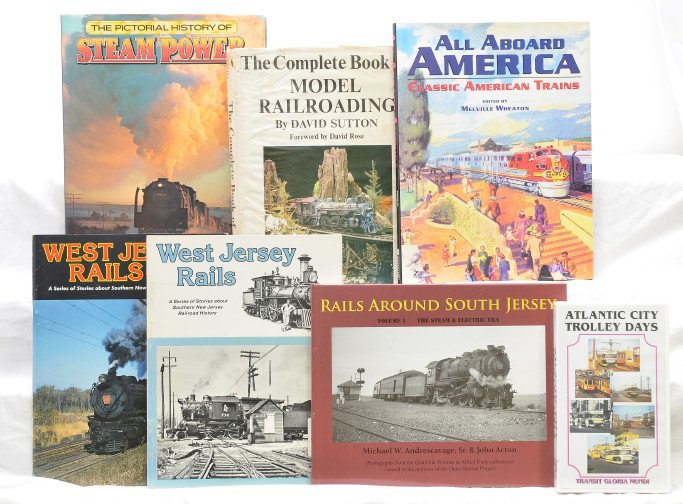 Selection of Reference Books Trolly Video: Selection of books including; The Pictorial History of Steam Power by J.T. Van Riemsdijk and Kenneth Brown, The Complete Book of Model Railroading by David Sutton, All Aboard America Classic American 