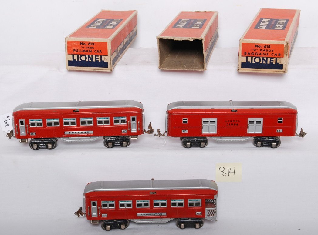 Lionel 613, 614, and 615 passenger cars in OB: Prewar Lionel O gauge red and silver passenger cars in original boxes, 613 Pullman, 614 observation, and 615 baggage. Cars have some surface rust on some couplers and bodies have splotchy finish. Cars