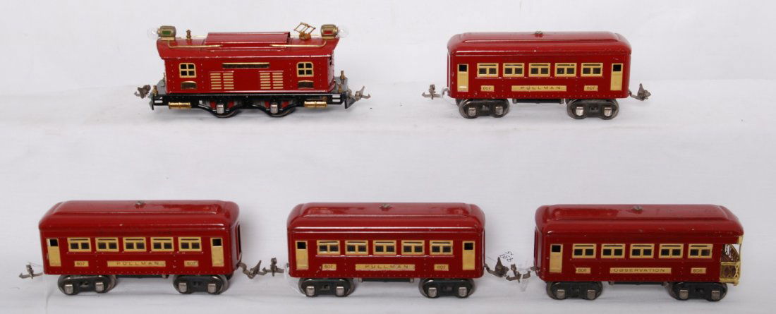 Lionel 253, 607, 607, 607, 608 red and cream passe: Prewar Lionel O gauge MacyÕs Special set with 253 box cab electric locomotive with three 607 Pullman, and 608 observation, C6. Loco and cars are red with cream trim.