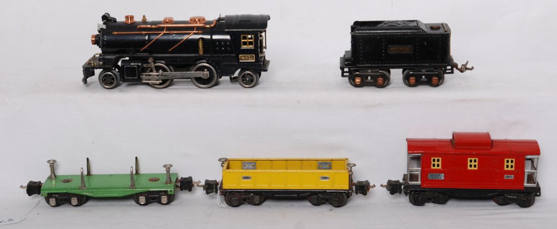 Lionel 262E loco, 262T, 2651, 2652, 2657 freight c: Prewar Lionel O gauge 262E steam locomotive and 262T tinplate tender (missing front coupler) trimmed in copper, 2651 lumber car, 2652 gondola, 2657 caboose, C5-6 with some light rust.