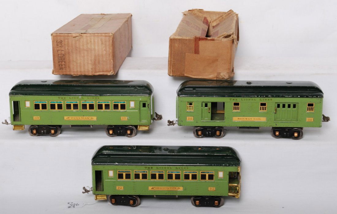Lionel 309, 310, and 312 passenger cars, two OB: Prewar Lionel standard gauge 309 Pullman, 310 Railway Mail (touchups on roof), and 312 observation, passenger cars with two original boxes, C6 area. One box is worn with older paper tape repairs. 312