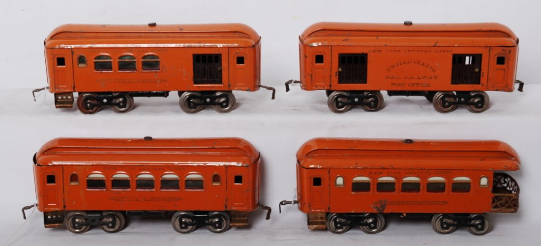 Lionel 31, 32, 35, and 36 orange passenger cars: Prewar Lionel standard gauge 31 combine, 32 RPO, 35 Pullman, and 36 observation, passenger cars in orange paint, rust on couplers, wheels,and axles, C6.
