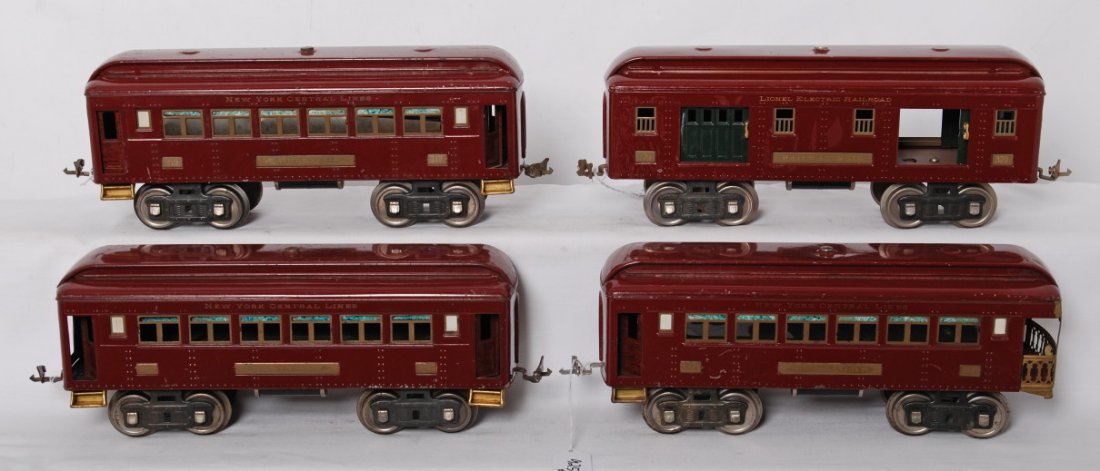 Lionel 319, 319, 320, 322 maroon passenger cars: Prewar Lionel standard gauge passenger cars in maroon paint, C6. Two 319 Pullmans, 320 Railway Mail, and observation.