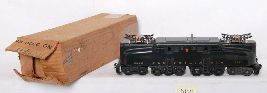 Lionel 2360-25 Pennsylvania 5 stripe GG-1 electri: Postwar Lionel O gauge 2360-25 Pennsylvania 5 strip GG-1 electric locomotive in original box with lighter stripes, otherwise C7. OB has tan packing tape on one end. Box otherwise is square and solid w