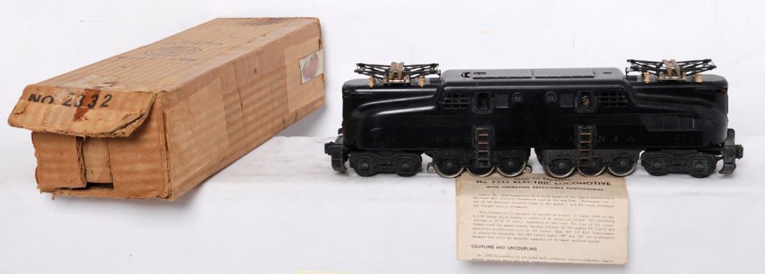 Lionel 2332 Pennsylvania black GG-1 electric in O: Postwar Lionel O gauge 2332 Pennsylvania GG-1 electric locomotive in original box, black. Great C7 area paint, C6 decoration. Box is missing an outer flap, tape residue. Insert is present and included