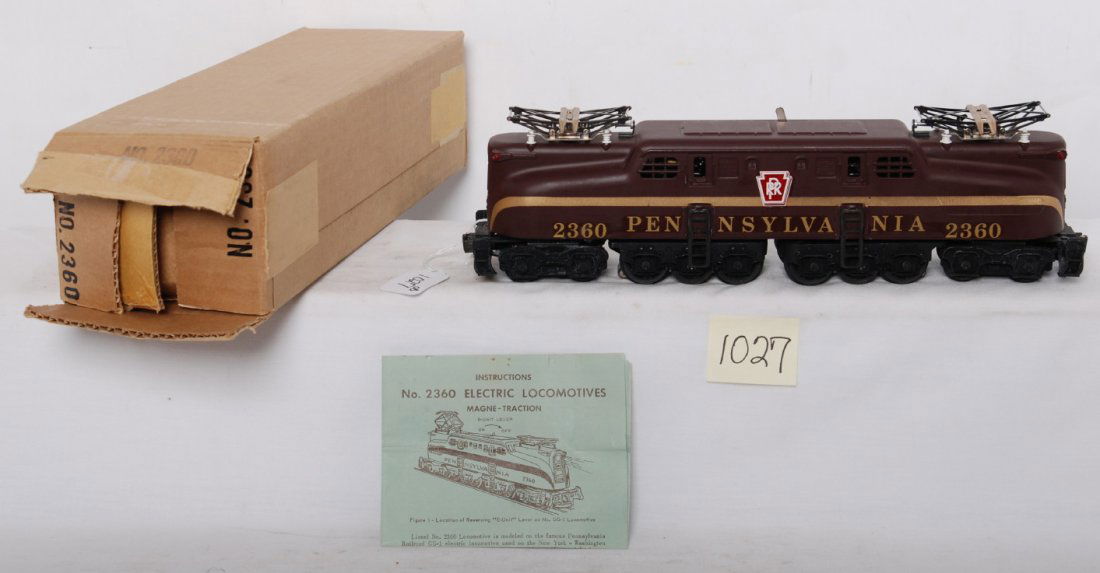 Lionel 2360 Pennsylvania GG-1 Tuscan single in OB: Postwar Lionel O gauge 2360 Pennsylvania GG-1 electric locomotive in original box with insert, wrapping paper, instructions sheet. Loco is Tuscan single stripe with decal lettering variation, extremel