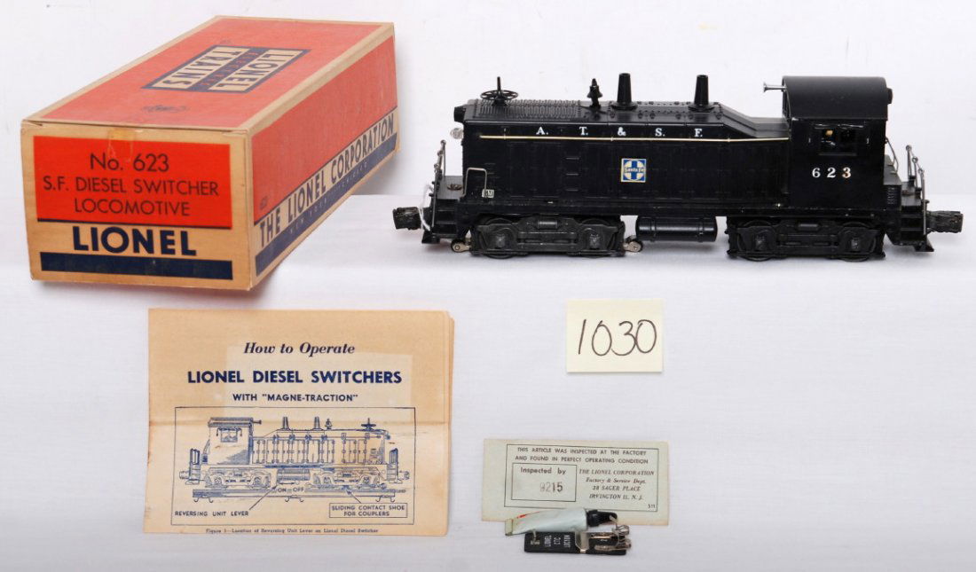 Lionel 623 ATSF switcher in OB Mint, factory erro: Neat Postwar Lionel O gauge 623 A.T.&S.F. diesel switcher locomotive in original box with insert, wrapping paper, instructions sheet, inspection slip, CTC Lockon, and tube of Lionel Lubricant, C8+ are