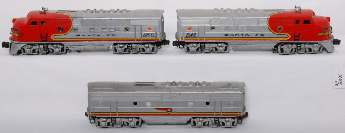 Lionel 2333 Santa Fe EMD F3 A-B-A diesel locos: Postwar Lionel O gauge 2333 Santa Fe EMD F3 diesel A-B-A units with heat stamped lettering and screened roof vents. Dummy unit has a hairline at a porthole lens. Some missing porthole lens, some repro