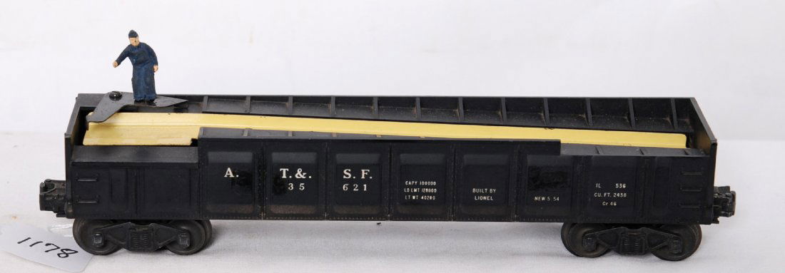 Lionel 3562 ATSF barrel car w/yellow trough: Postwar Lionel O gauge 3562 A.T.S.F. operating barrel car with yellow trough. Two spots of tape residue on one side, otherwise C7-8.